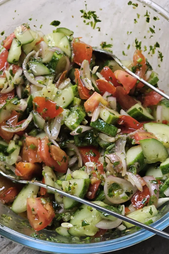 mixing Cucumber Tomato Salad